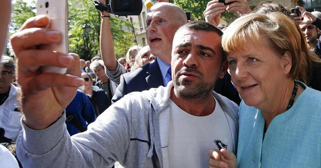 1200x630_313254_migrants-angela-merkel-visits-berli.jpg