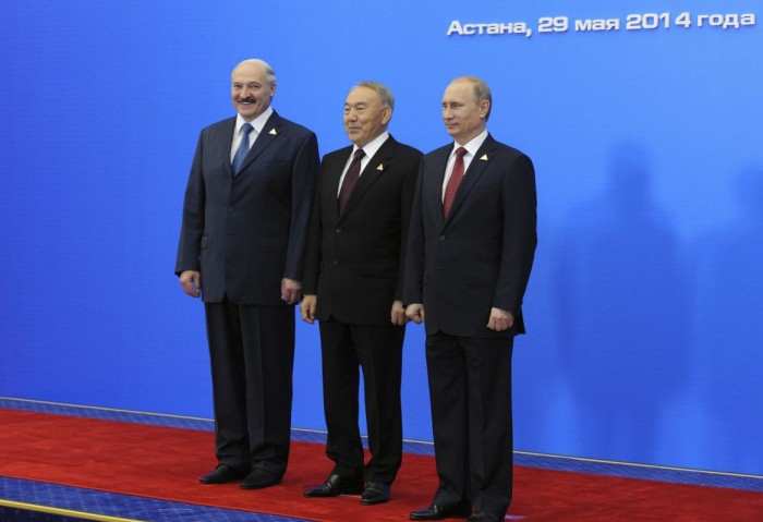Russian President Putin, Kazakh President Nazarbayev and Belarus President Lukashenko stand for a photograph before a meeting of the Eurasian Economic Union in Astana